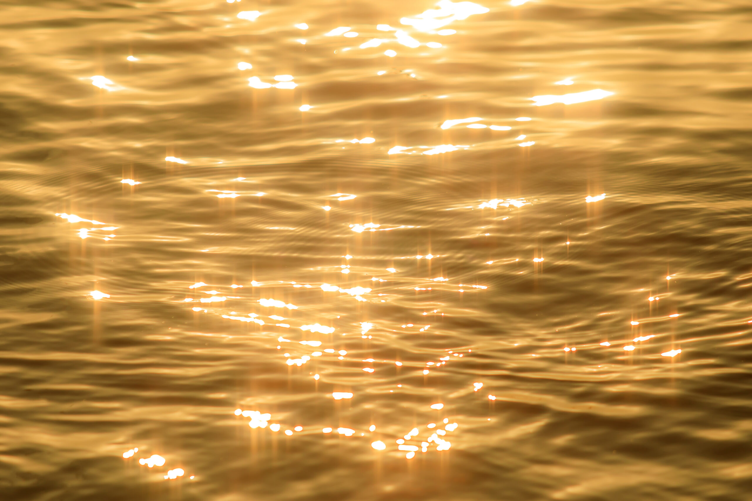 Soft golden ripples across calm water